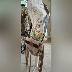 Myra Bag cowhide and leather crossbody bag with leather fringe.